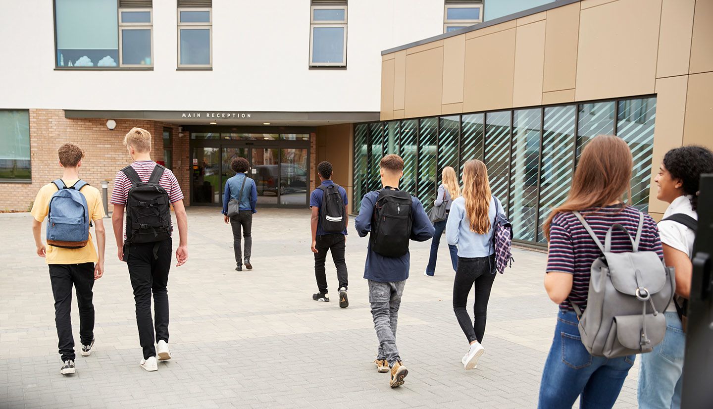 Students walking into a school building