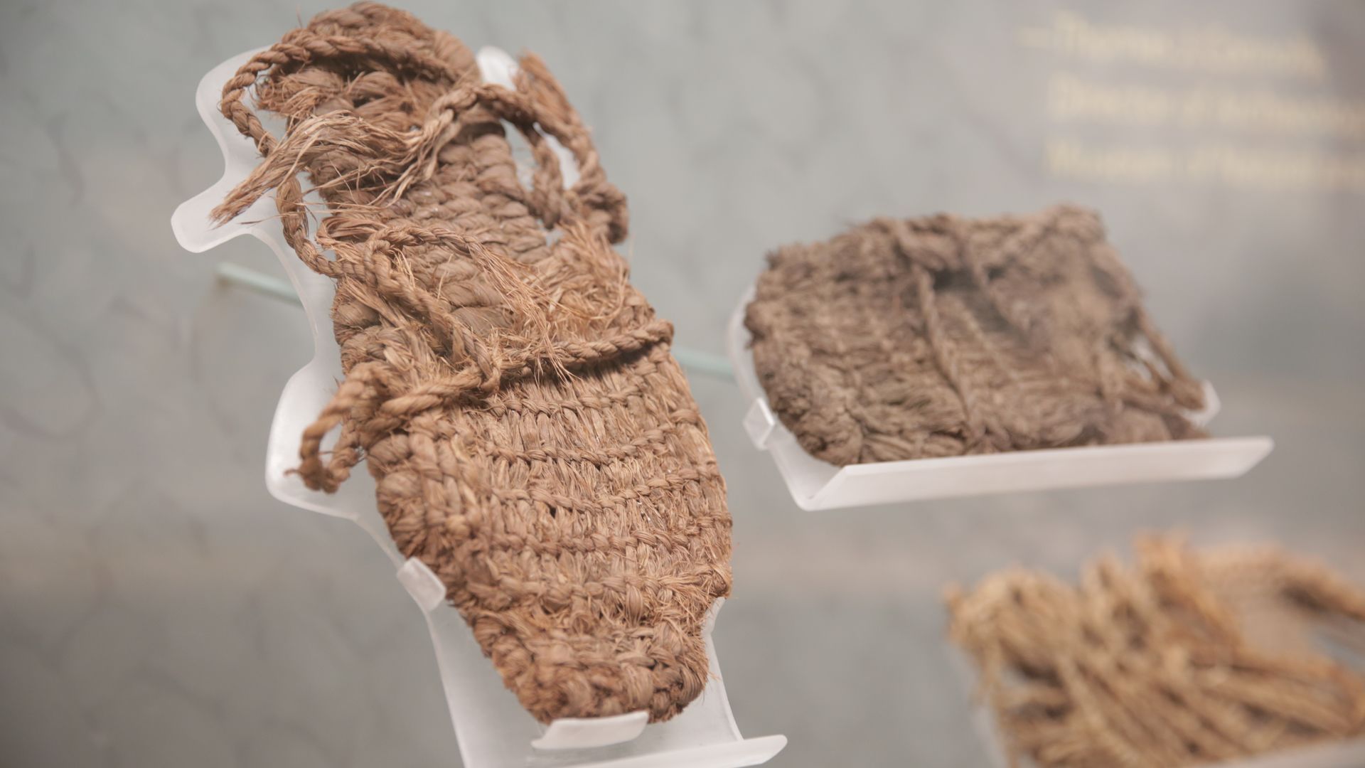Museum exhibit showing ancient sandals
