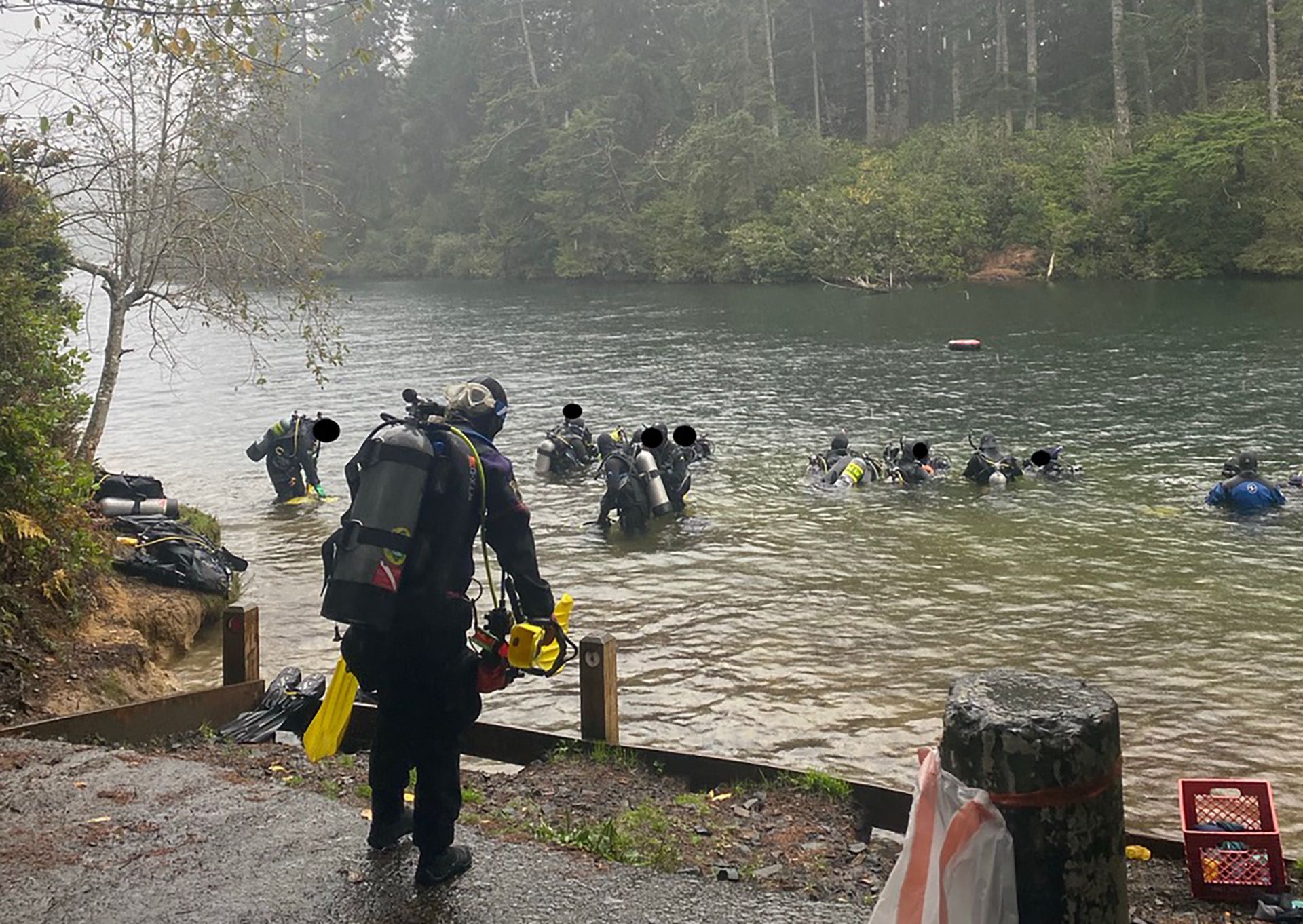 Scuba divers entering the water