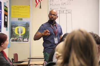 Nate Jackson mid lecture in a high school classroom