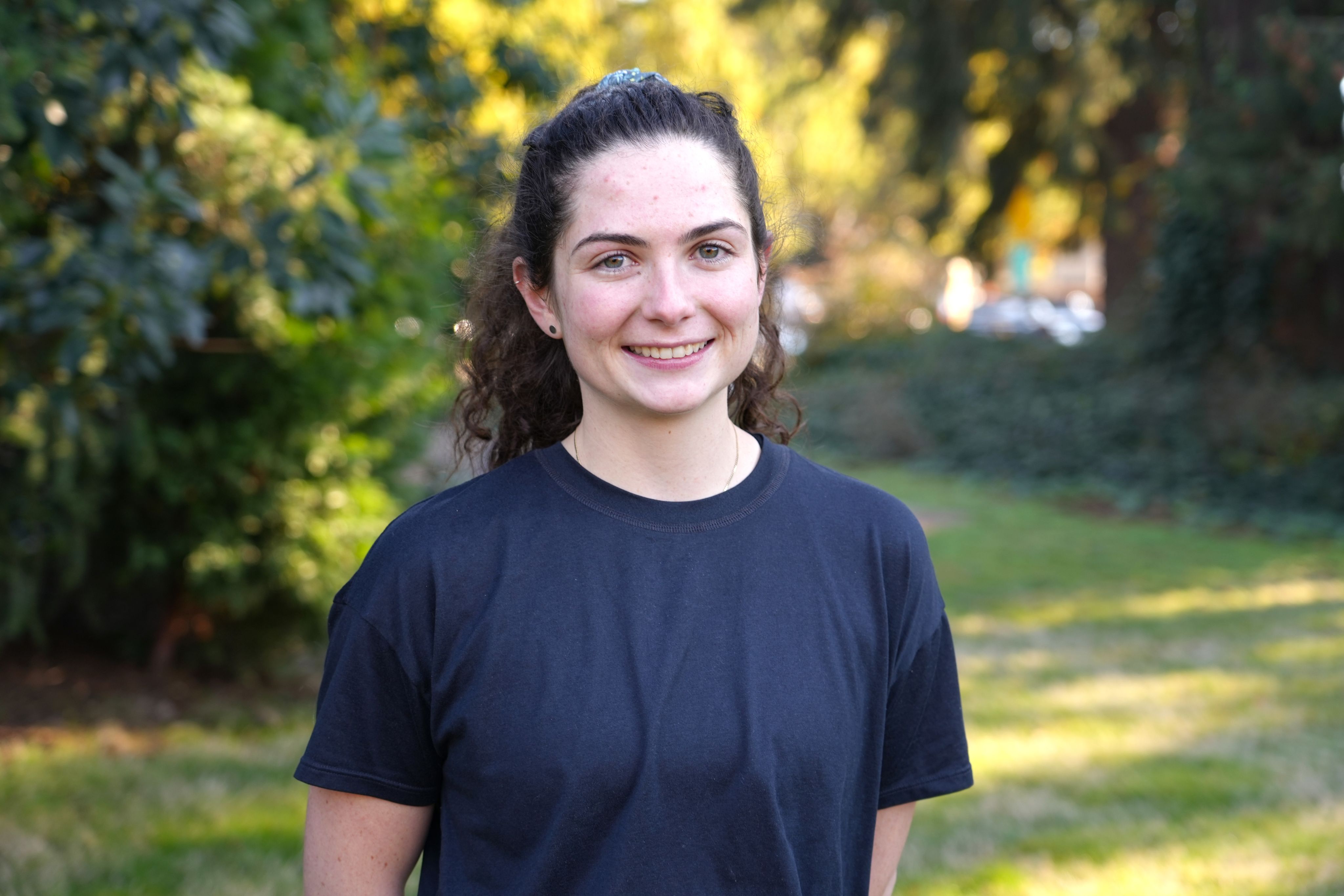 Outdoor portrait of a woman in a navy shirt