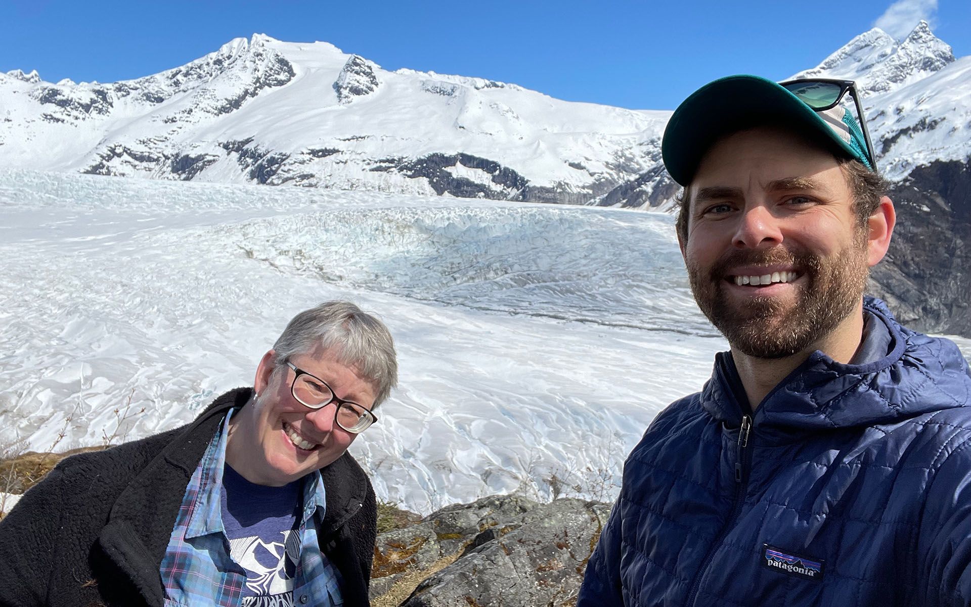Melissa Lucash and James Lamping hiking near a glacier