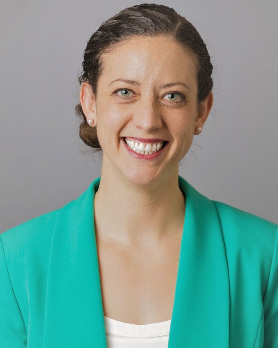 A portrait of a smiling woman